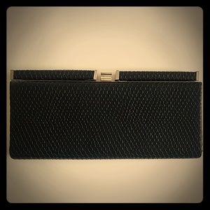 Black snakeskin clutch